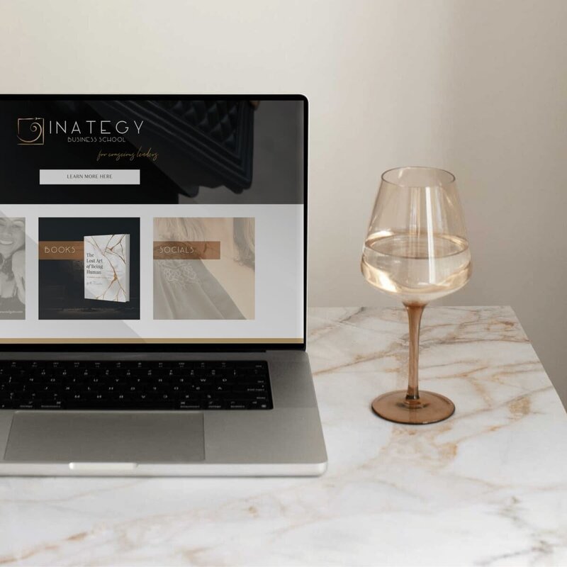 Device mockup showing Leigh Jane Woodgate’s website on laptop, custom website design by Rachelle Deem for business coach
