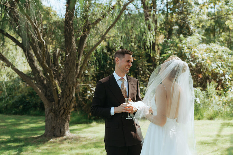 couple laughing on their wedding day, captured by Elsie Goodman, an NYC wedding, engagement and couples photographer