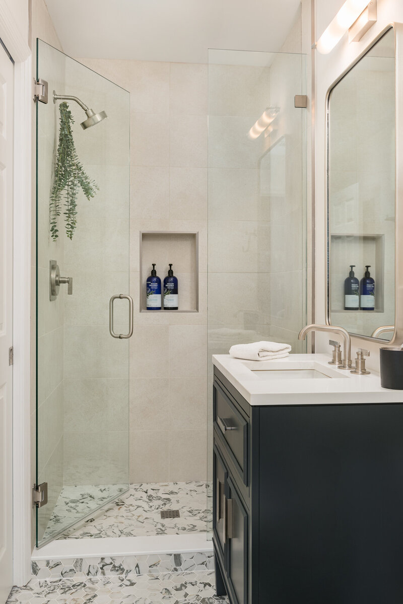 Glass shower door and tile details at Palma Ceia_Scarbro Design