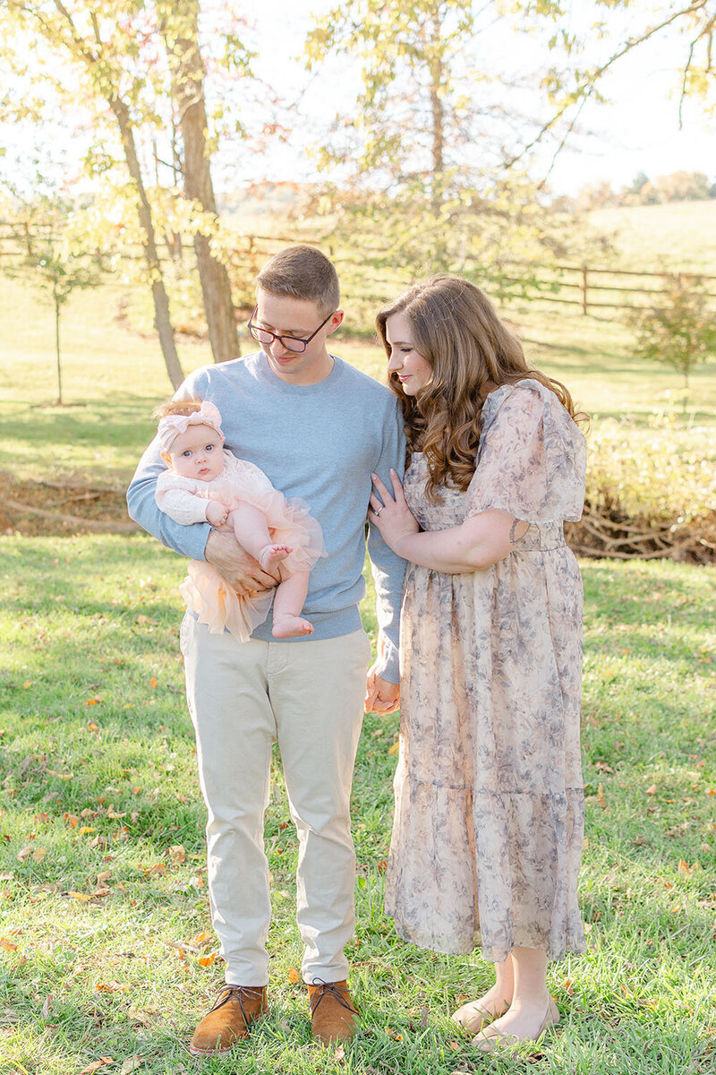 parents looking at baby girl in Vienna, Virginia