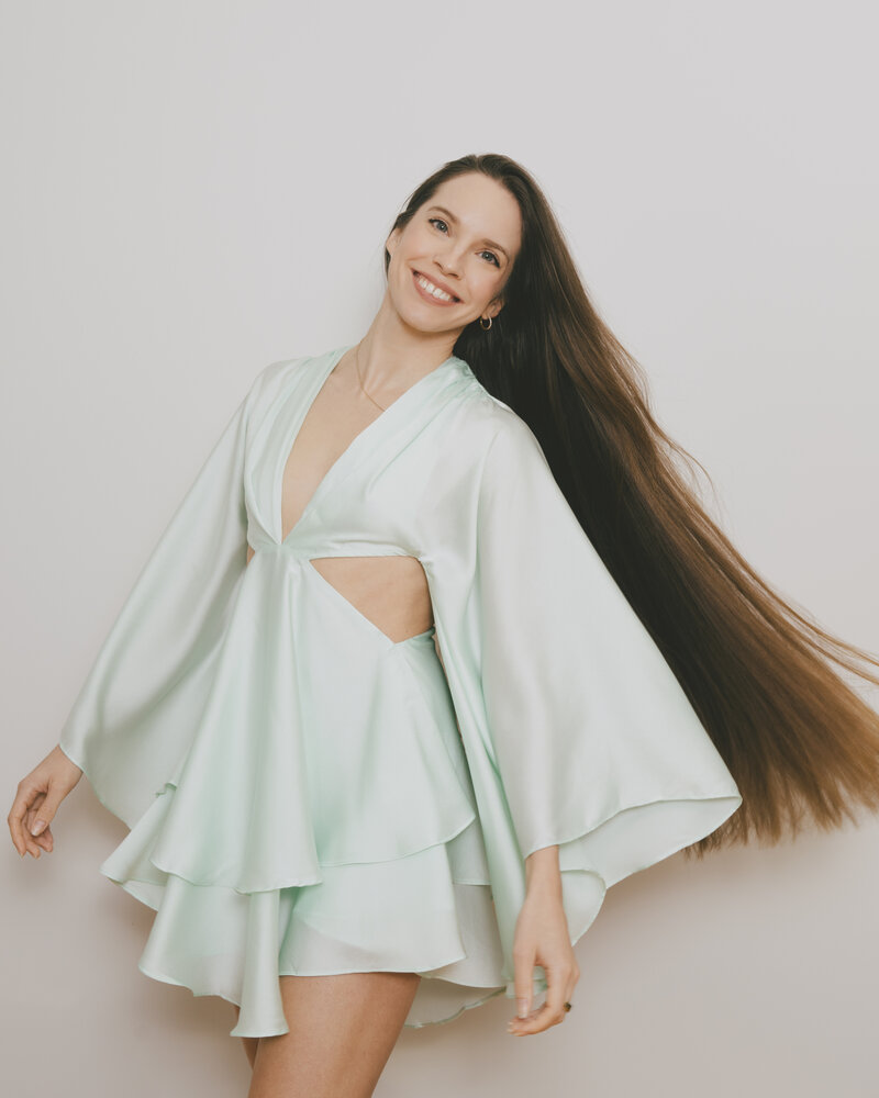 sarah nagel of holistic habits smiling with long hair