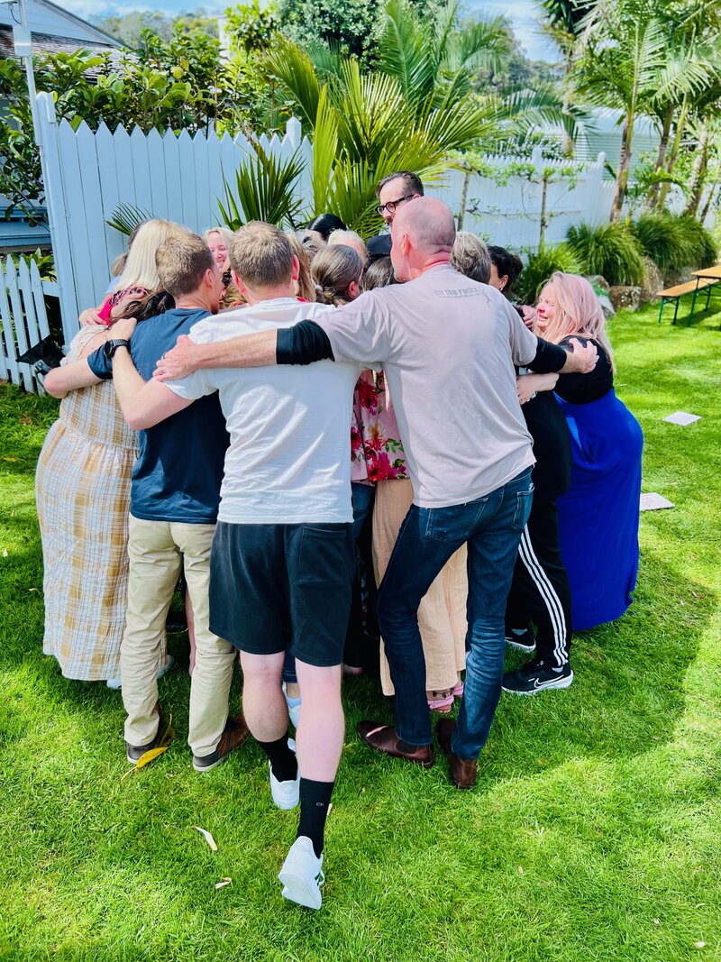 Women seated in circle during retreat, eyes closed in breathwork — “Mums in business reconnecting to purpose and clarity through guided embodiment at Season 26 – Beyond!”
