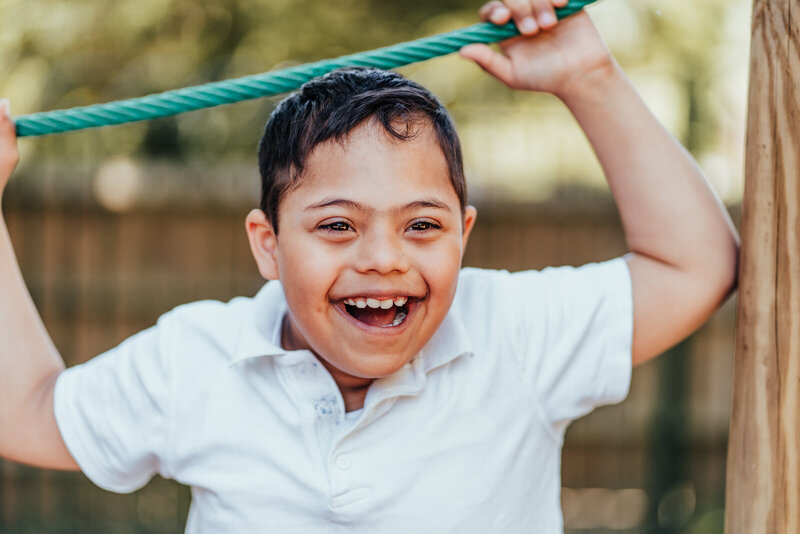 Boy smiling on playground at North Waltham Primary School