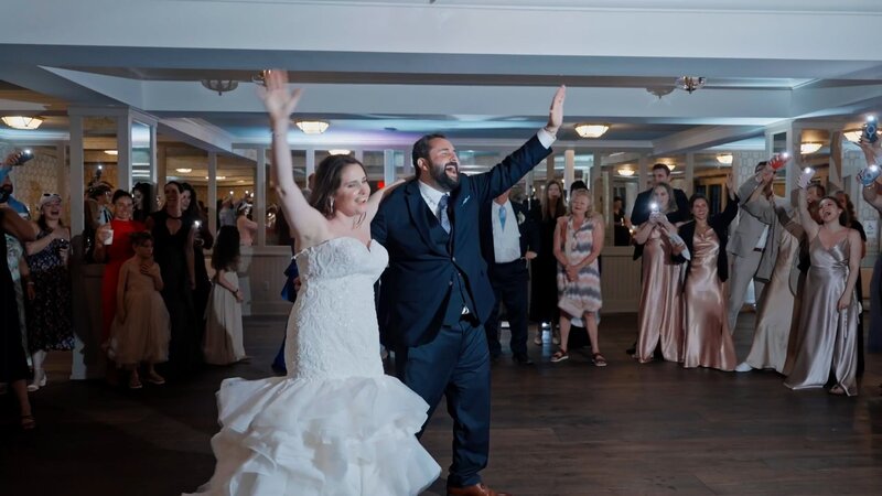 Kristen & Jacob walk into harbor view hotel at martha's vineyard  greeted by family and friends