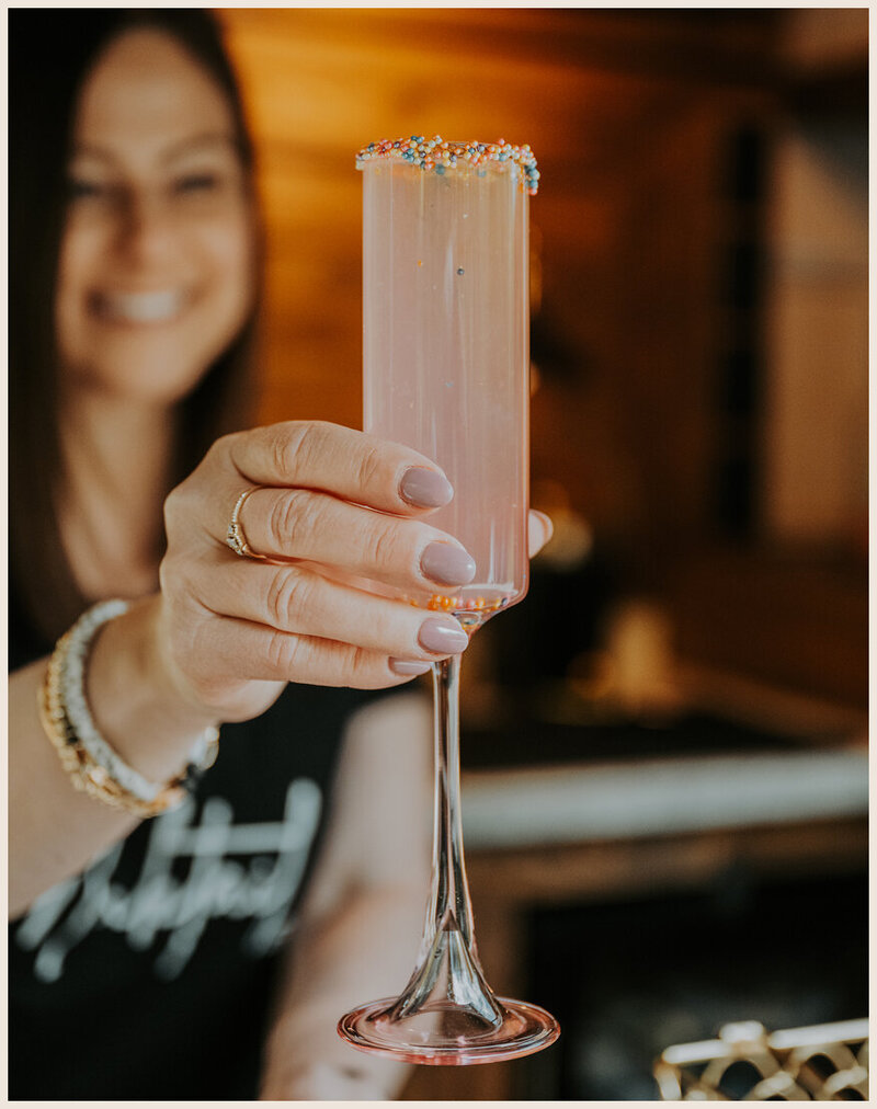 Amy handing a Mocktail out