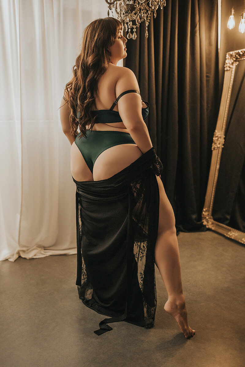 beautiful curvy woman posing in boudoir photography studio in vancouver bc