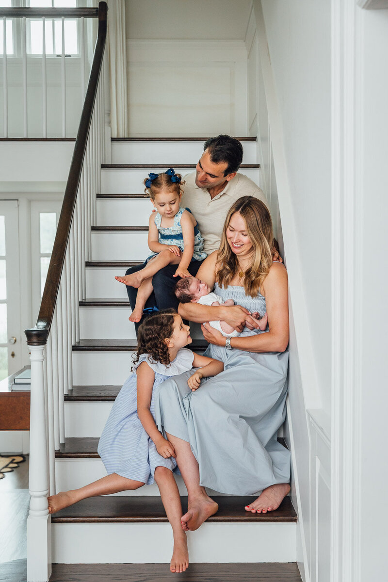 son hugging moms leg long island family photo session