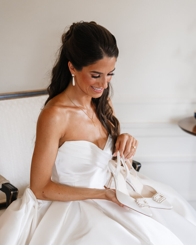 Bride highlighting her wedding shoes at Greencrest Manor in Michigan