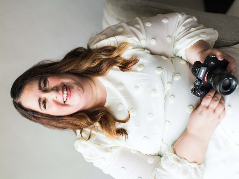 Houston's best wedding photographers Swish and Click smiles with her camera