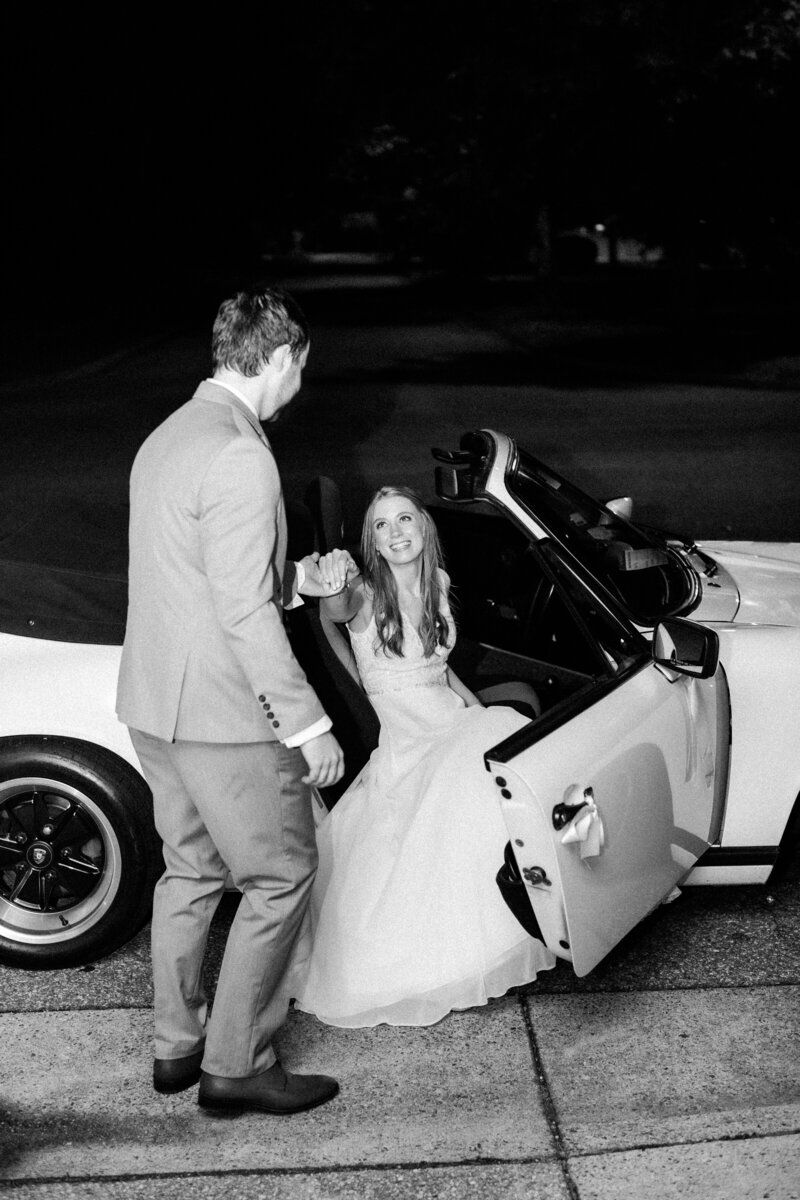 Classic getaway car with "Just Married" decorations outside Colonial Williamsburg wedding, captured by Morgan Renee Photography