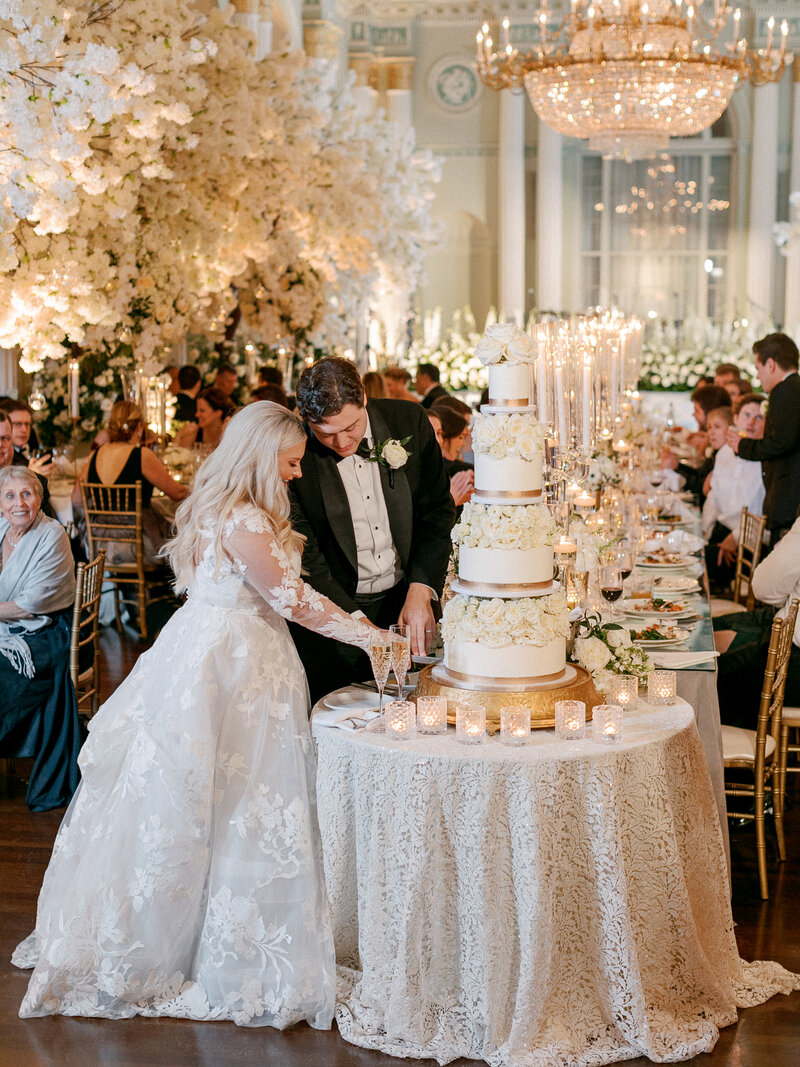 Bride and groom kissing during outdoor wedding ceremony
