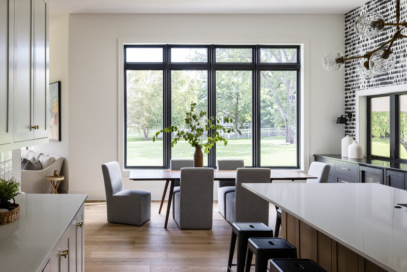 Bold neutral modern dining room and kitchen design by Leawood interior designer Kara Kersten Design.