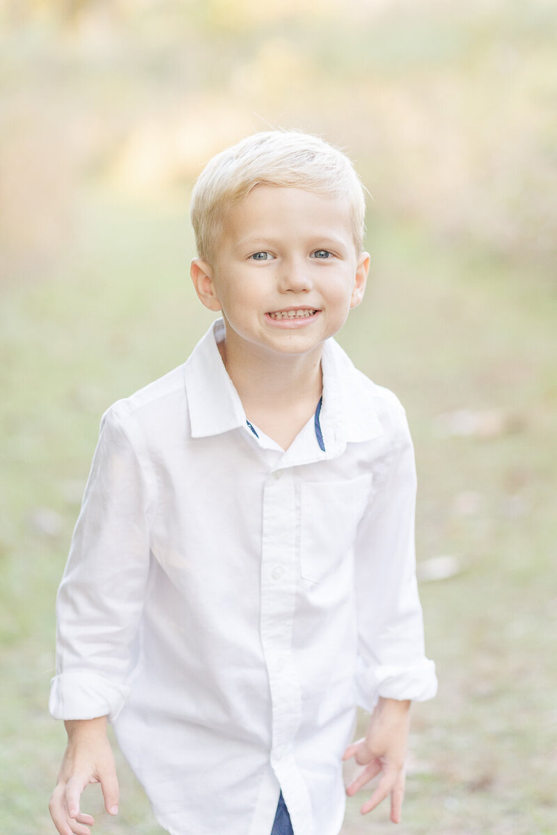 boy smiling taken by a Northern VA fall mini session photographer