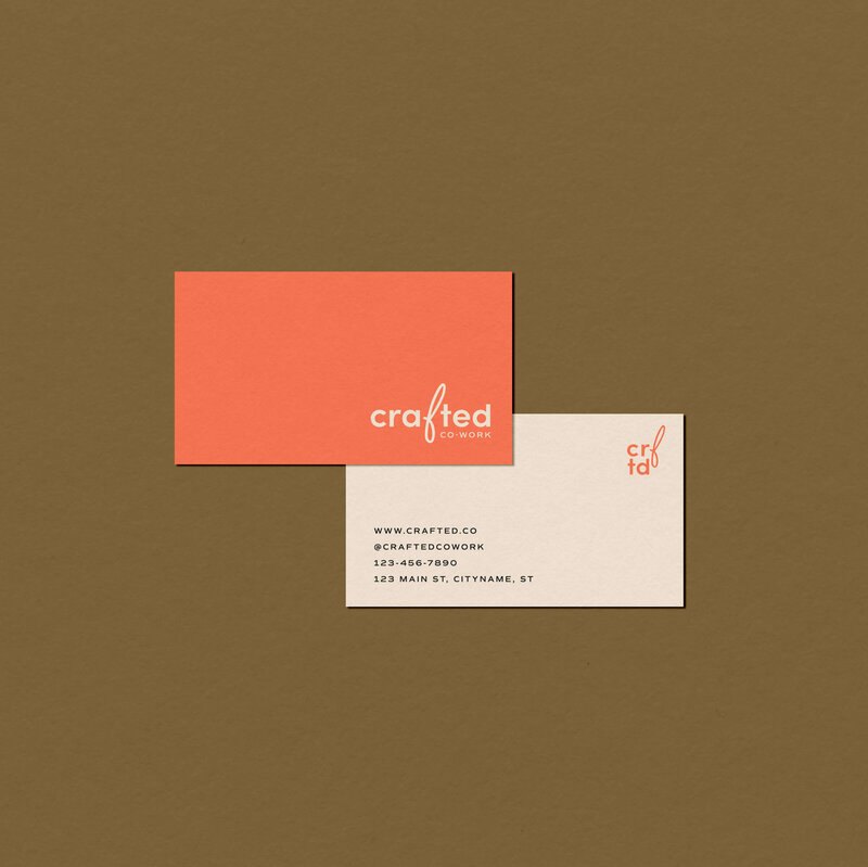 Coral and cream colored business card design for women's coworking space on green background