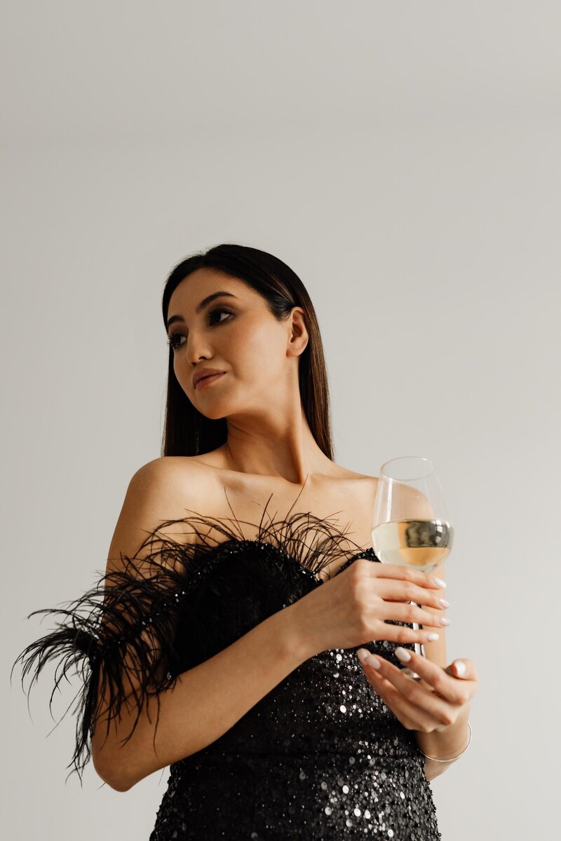 kaboompics_classy-aesthetics-beautiful-asian-woman-in-black-evening-dress-white-wine-in-a-glass-29534