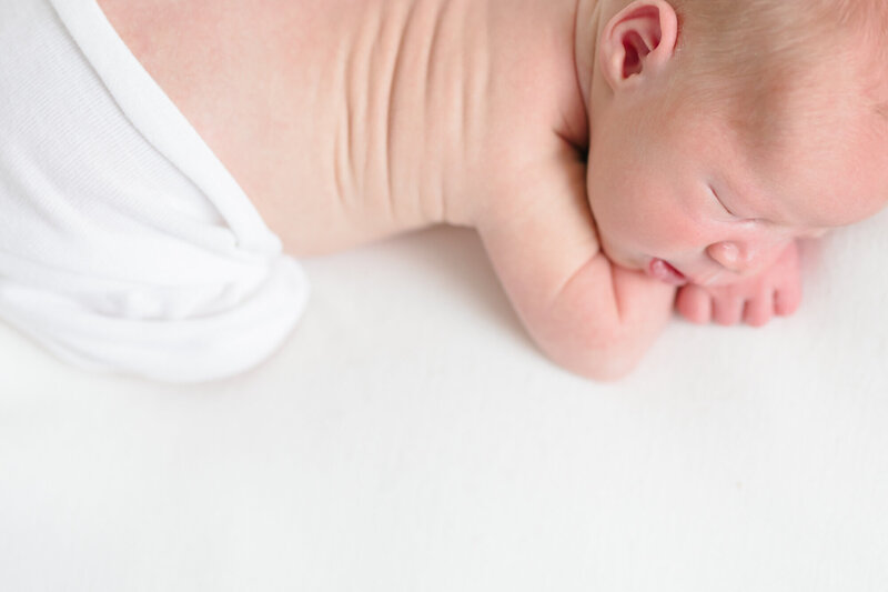 Portrait of a newborn sleeping on his belly taken by northern kentucky newborn photographer missy marshall