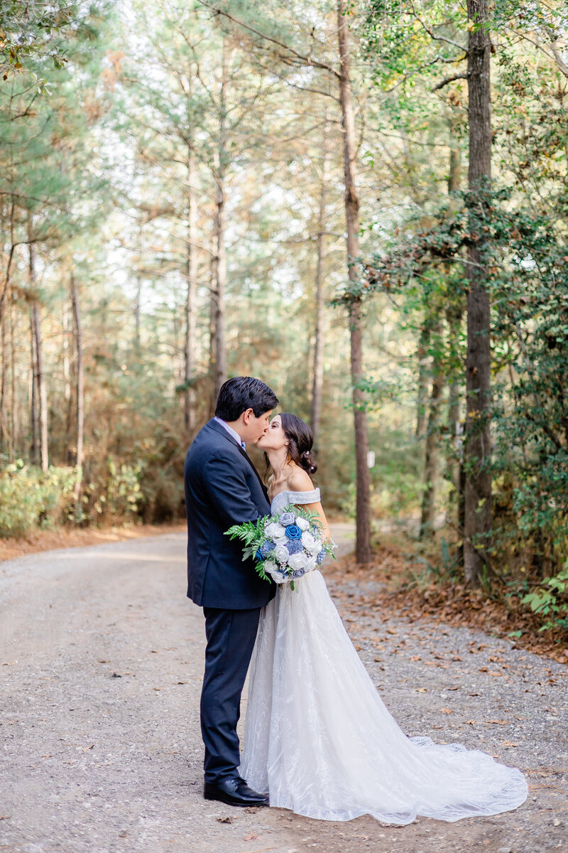 Newlywed couple holding hands and running together in front of wedding venue