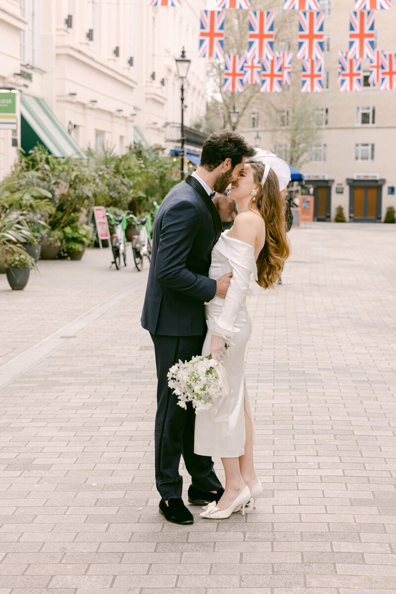 A wedding photo of the couple sitting at a café in Paris France