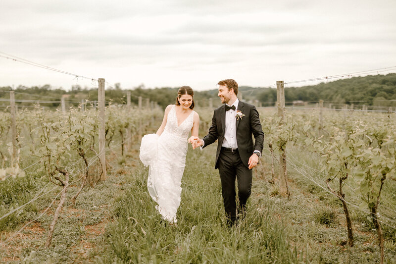bride and groom holding hands