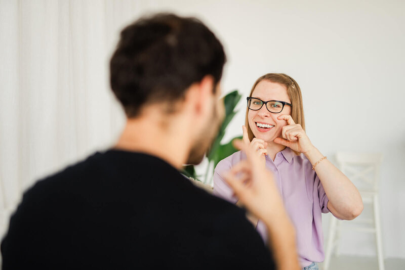 Stephanie shows a student how to move their mouth in an accent coaching session.