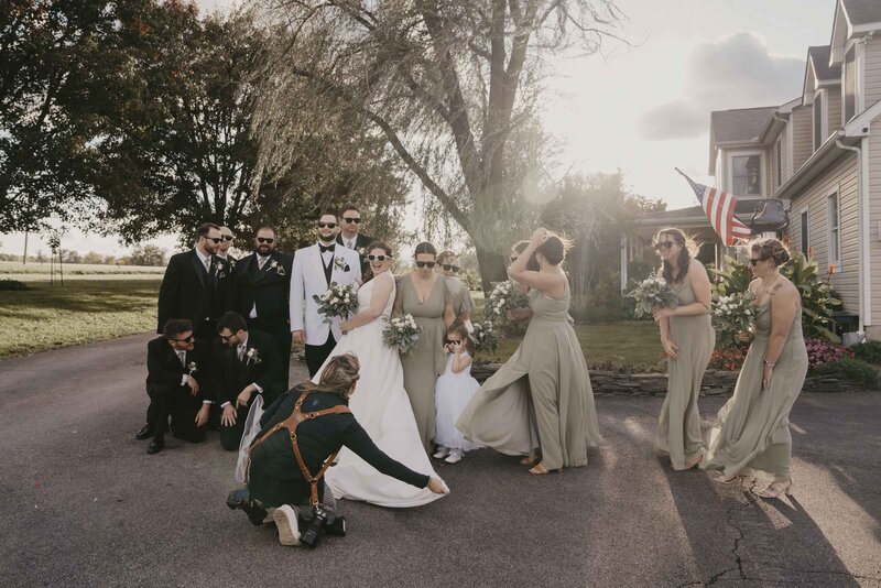 Photographers assisting bride
