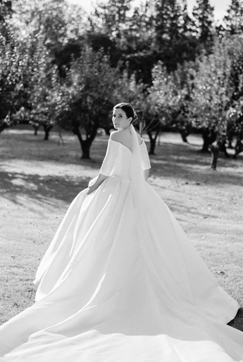 black and white portrait wedding photo of bride and groom looking to camera taken in cheshire