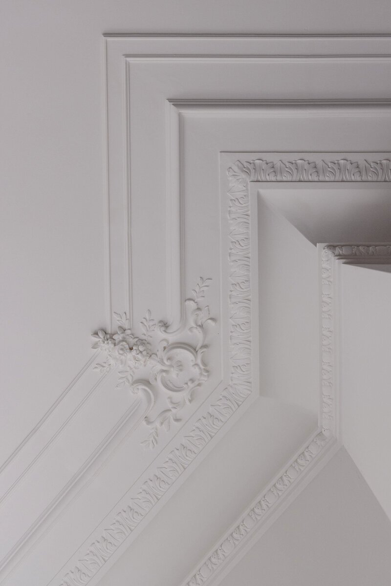 Custom hand-cast plater cartouches and crown molding in Boston home