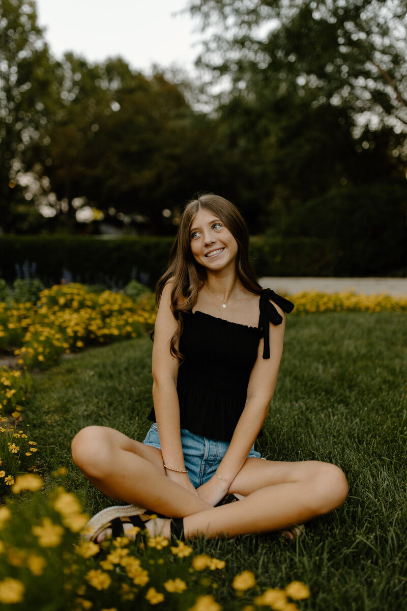 senior walking in front of yellow wall