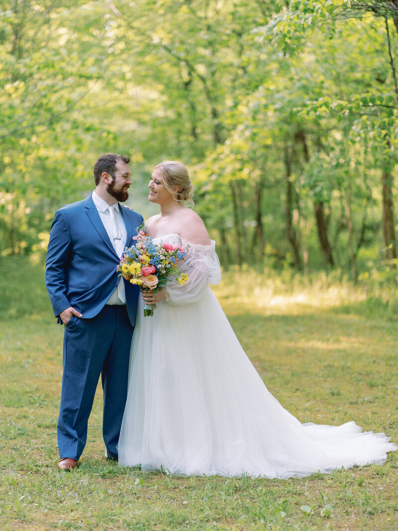 Groom kissing his bride's forehead