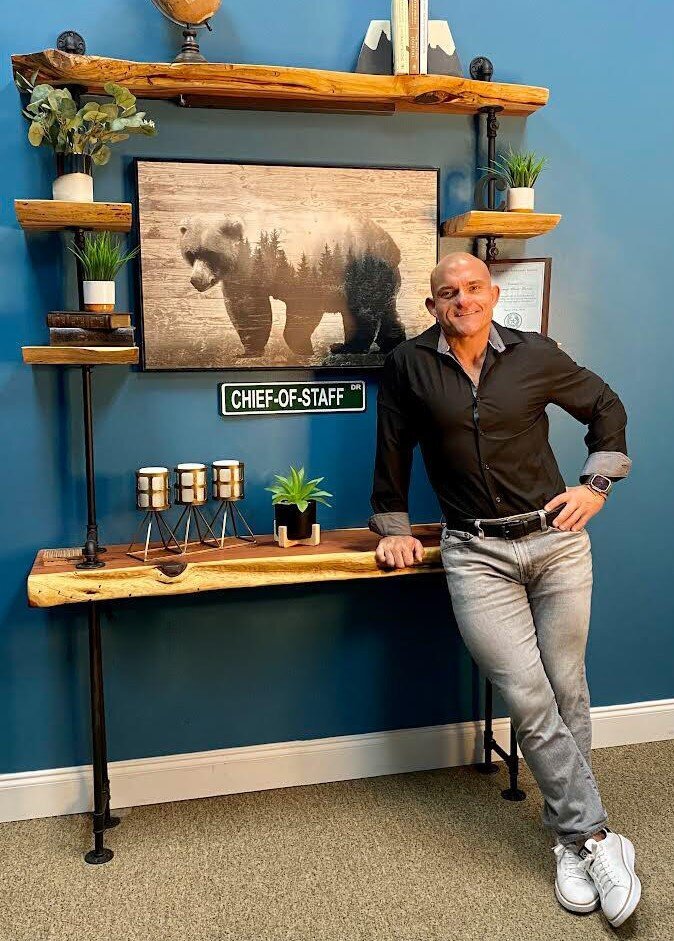 Clint Garza-black shirt-grey-jeans