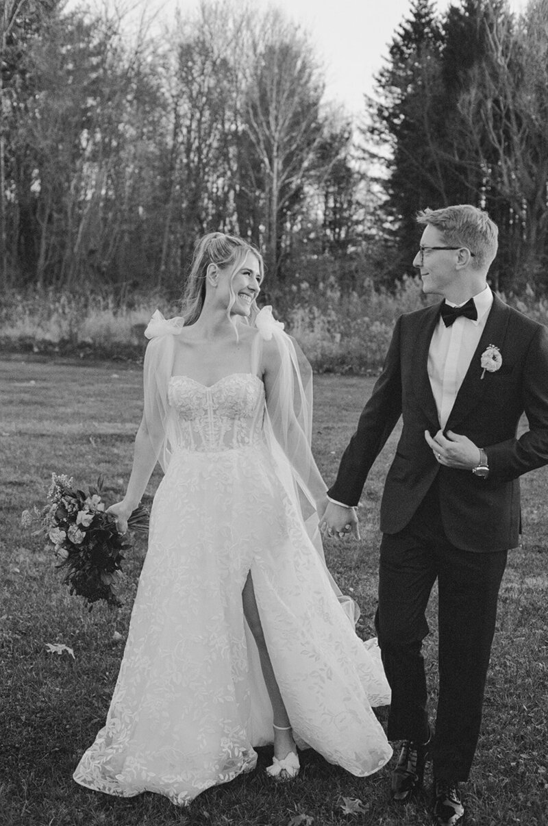 bride and groom hugging on beach