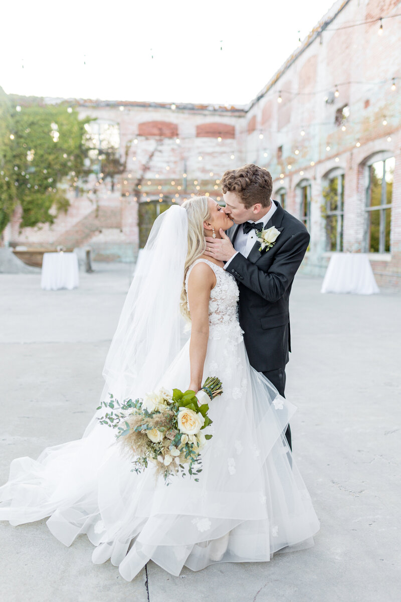 Bride and groom first kiss