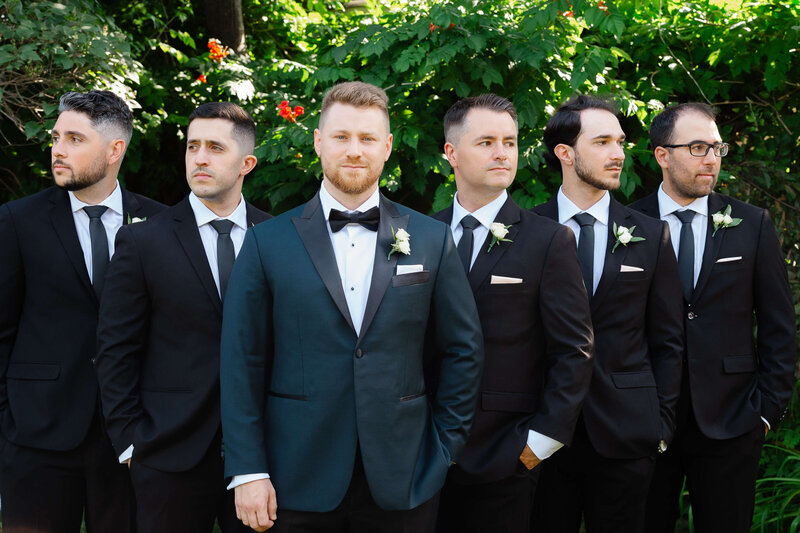 Ottawa wedding photos showing a serious photo of a groom and groomsmen in their black tuxedos