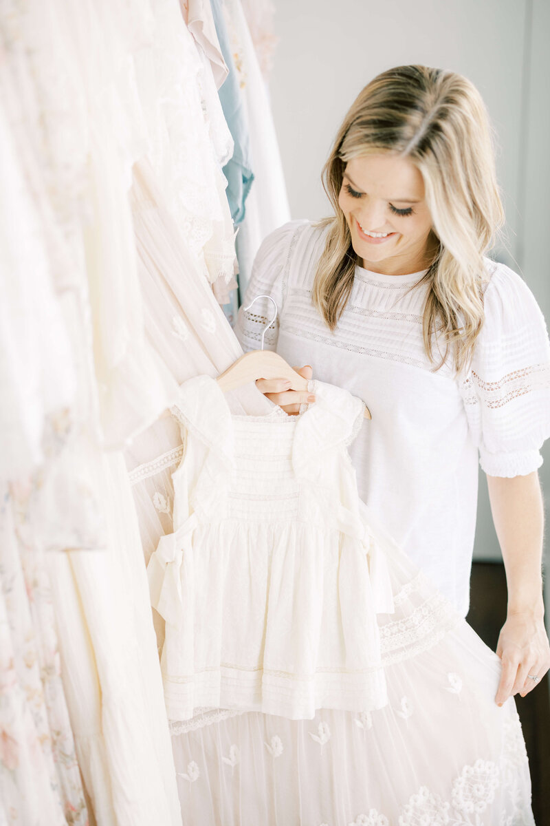 Kimberly selecting outfits from her client closet at the studio