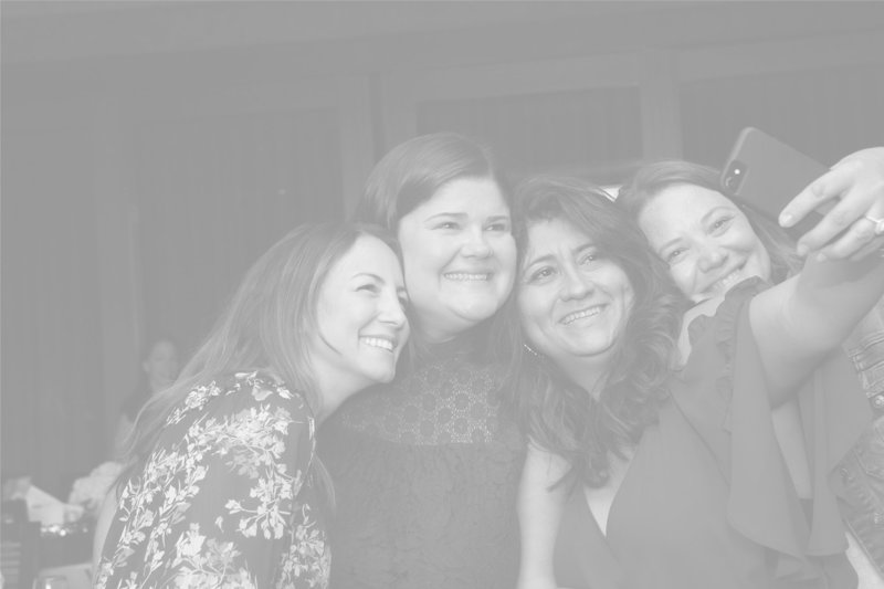 Founder Amanda Clark hugs a fellow caregiver at a Cocktails & Chemo event