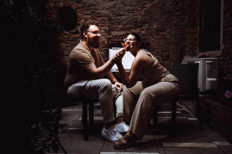 A couple enjoys some local food together while on vacation.