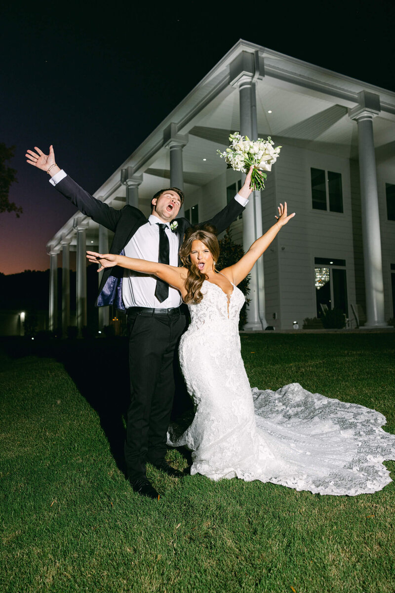 A wedding photo of the husband and wife celebrating