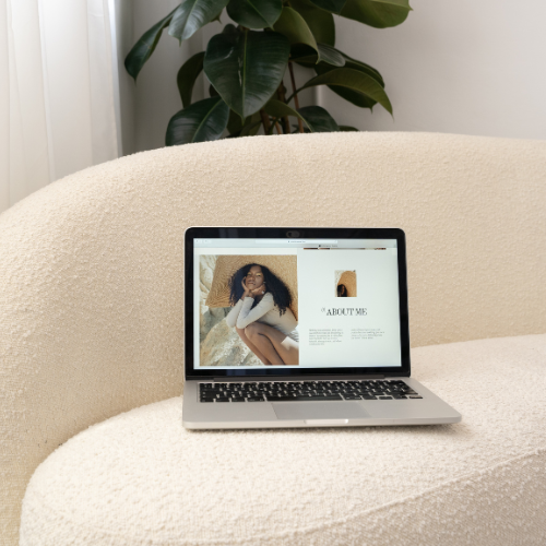 black podcast mic sitting on desk with women working