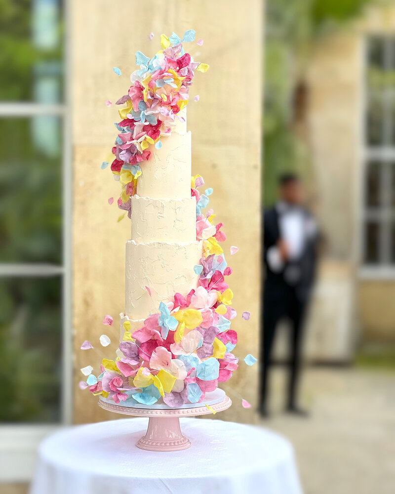 Three tier Asian Wedding Cake with acrylic spacers from Prop Options with stencilled buttercream & enchanted forest themed florals