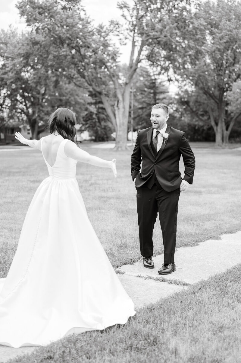 bride reveals her dress to the groom for the first time on wedding day