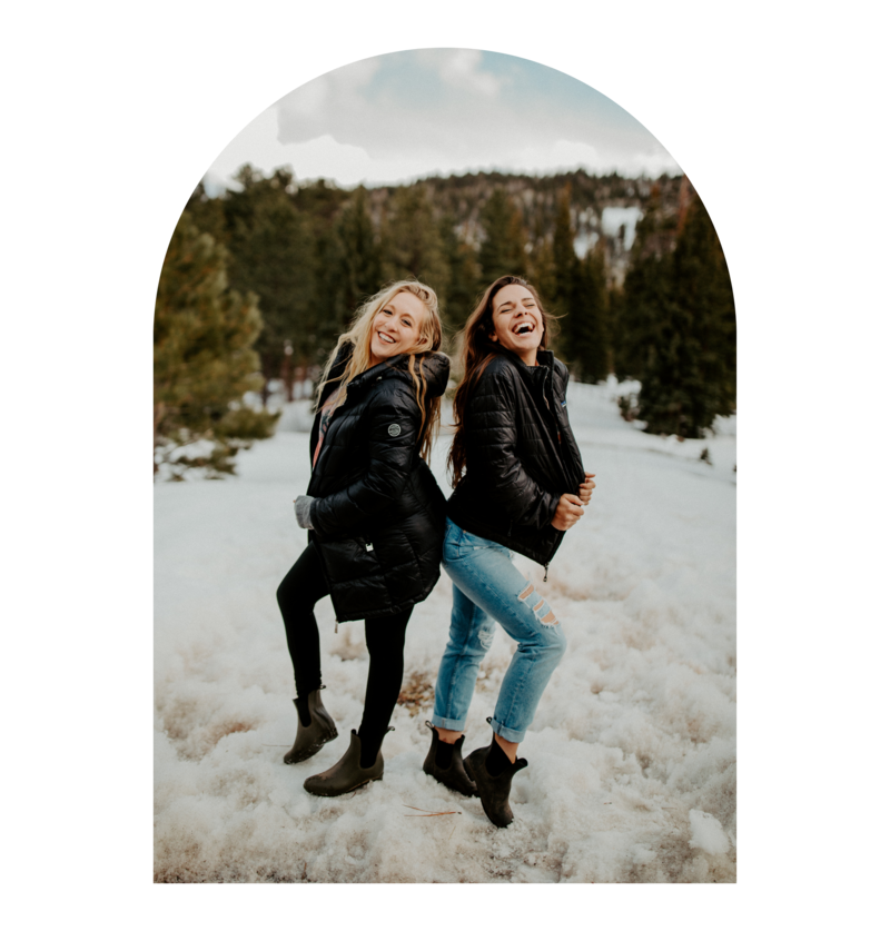 Best friends in the snow laughing and having fun