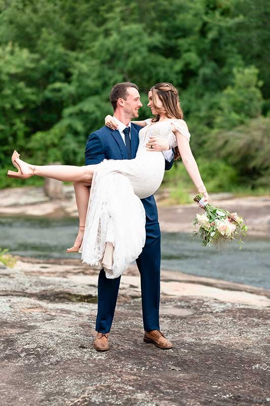 Just married photo of couple on rocky shore in Virginia