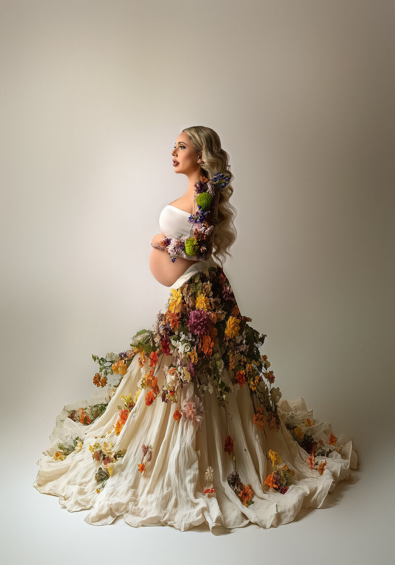 beautiful maternity photograph in luxury gown with vintage florals