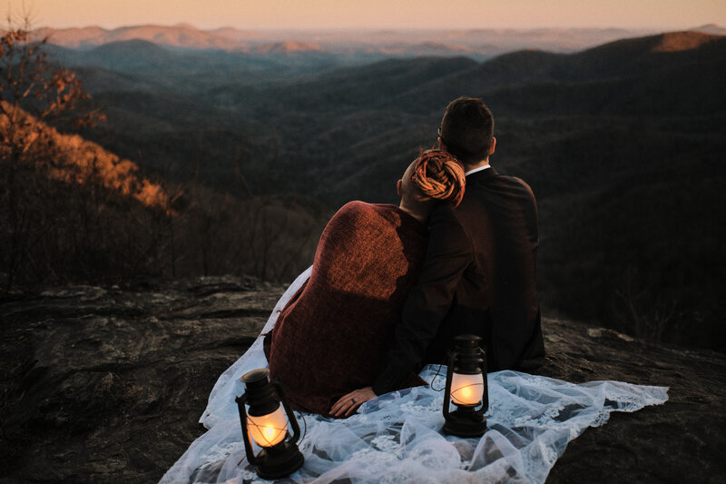 Couple looking out onto the North Georgia Mountains at sunset