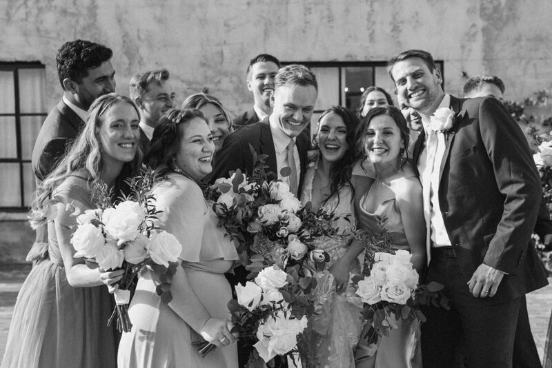 wedding party group photo laughing