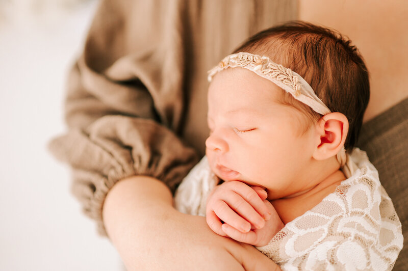 side profile of sleeping newborn baby girl during Springfield MO newbonr photography session