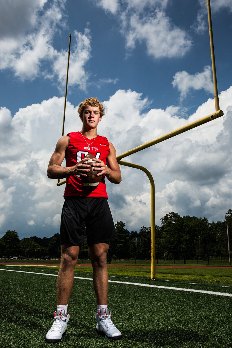 High School Senior Football Player on Field