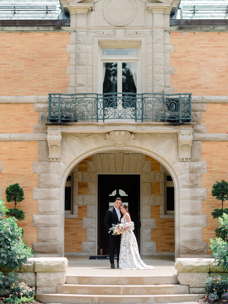 An intimate, sunlit close-up of a bride and groom sharing a joyful moment, captured by Elizabeth Kane, a fine art wedding photographer serving Philadelphia, New York, and beyond.