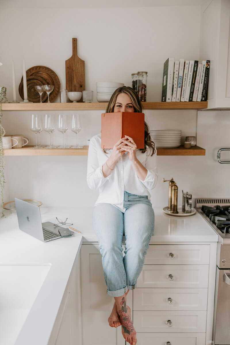 A copywriter for websites holding a notebook