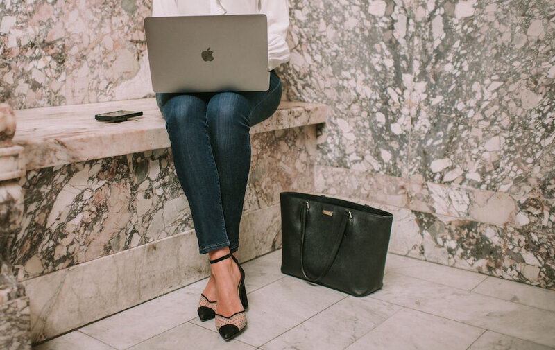 Girl working from her laptop outside